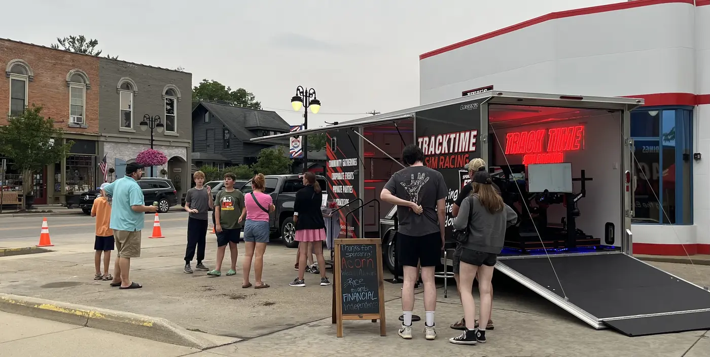 The trailer set up on a downtown street with people waiting their turn