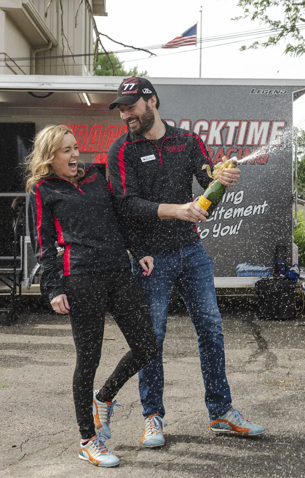 The Track Time crew celebrating outside the trailer
