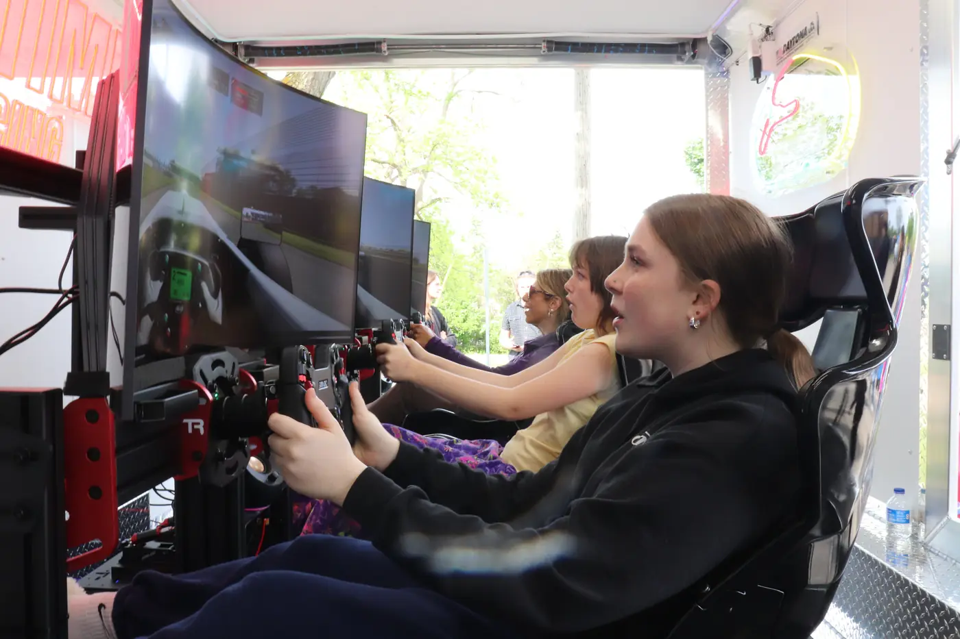 Racers competing side by side inside the trailer